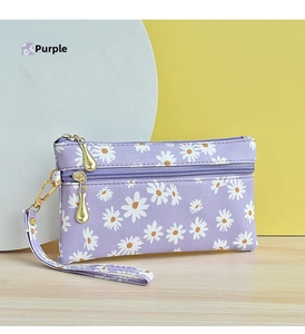 Detail of lavender daisy clutch bag with dual zippers and gold drop-shaped metal pulls