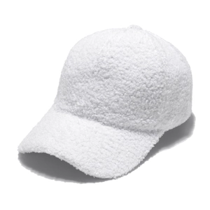 Detailed texture of white fluffy sherpa baseball cap showing premium wool-like fabric