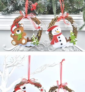 Detailed view of Christmas rattan wreath with felt bear and snowman on a fireplace mantle