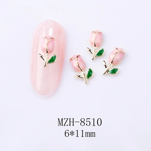Macro shot of 6x11mm pink tulip nail charms with gold alloy edges and glossy finish