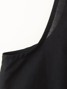 Close-up of black cotton-linen blouse showing high-quality stitching and binding details