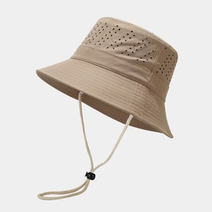 Detail view of khaki fishing hat showing laser-cut ventilation holes and woven chin strap