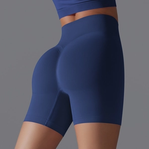 Close-up of deep blue high-waist seamless yoga shorts with scrunch-butt design and knit texture