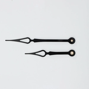 Set of black quartz wall clock hands with diamond cutouts and gold metal sleeves