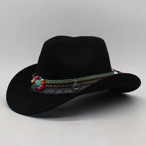 Detail of ethnic boho hat band with turquoise bead, coins and braided cords