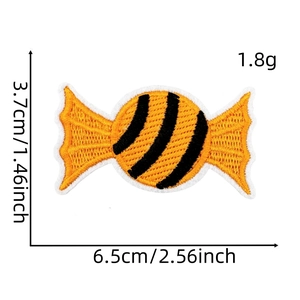 Detail of candy-shaped Halloween embroidery patch with size specs and orange stripes