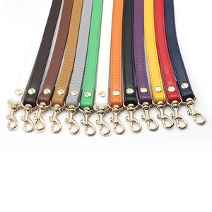 Detail of colorful PU leather bag straps with golden lobster clasps in 13 various colors