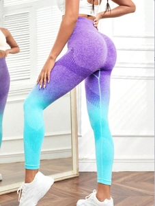 Detail of seamless high waist yoga leggings with purple and blue gradient texture
