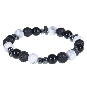 Close-up of beaded bracelet with green crystal, lava stone, and marble texture beads