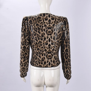 Detail of leopard print sequins on long-sleeve blazer jacket back view on mannequin