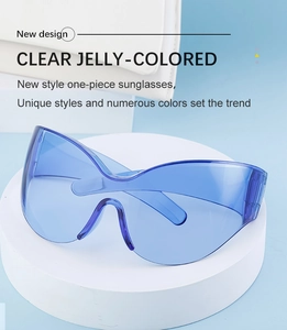Detail of clear blue jelly-colored oversized sports sunglasses on a white display stand