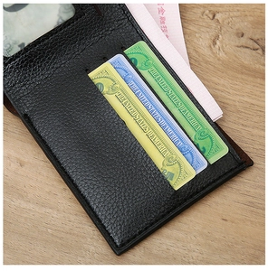 Detailed view of black leather wallet interior featuring three card slots and an ID window