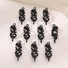 Detailed view of ten black vintage dragon pendants for DIY jewelry making accessories