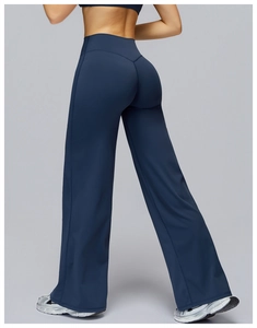 Close-up of high-waisted navy blue wide-leg yoga pants with premium matte stretch fabric