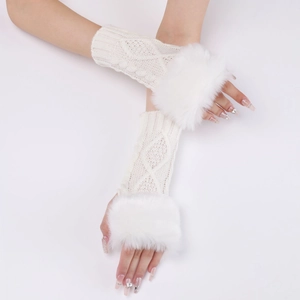 Detailed close-up of cream knit fingerless gloves featuring faux fur trim on wrists
