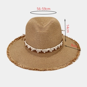 Women's dark khaki straw sun hat with frayed edges and white woven decorative band