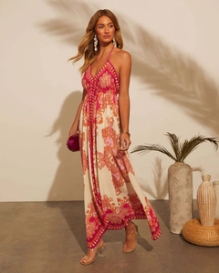 Detail of bohemian floral print dress with halter V-neck and tropical palm shadows