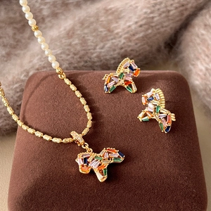 Gold plated unicorn pearl necklace and earring set with colorful baguette zircons