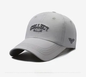 Detail view of light grey quick-dry baseball cap with 3D embroidery and reinforced brim