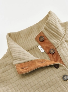 Detail of khaki men pullover featuring textured waffle fabric and suede trim collar