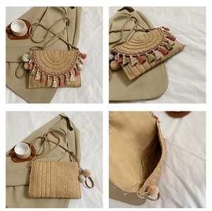 Straw clutch bag detail showing bohemian tassels, pom-poms, and interior lining structure
