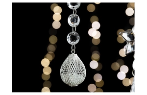 Macro shot of tiered crystal beads and silver mesh teardrop pendant decoration