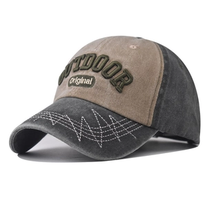 Detail of outdoor baseball cap showing vintage washed cotton and 3D embroidery textures