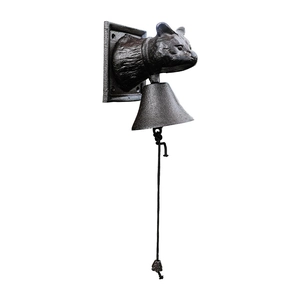 European vintage cast iron doorbell with cat head design and woven pull rope