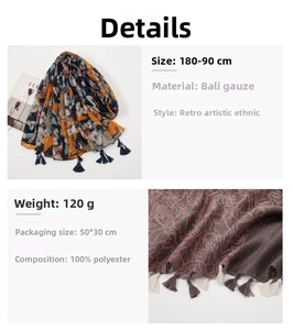 Close-up of bohemian red floral scarf with detailed tassels and breathable fabric