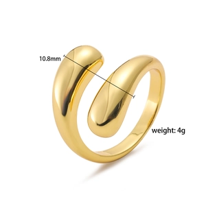 Detail view of golden liquid metal open ring with polished teardrop ends and 10.8mm width