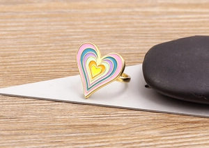 Detail of multi-layer colorful enamel heart ring with 18K gold plated finish