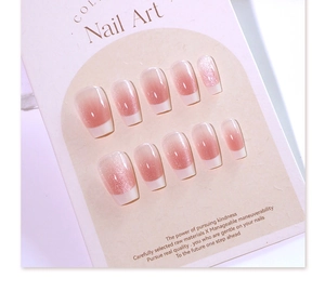 Detailed view of cat eye pink gradient press-on nails on product display card