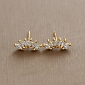 Macro shot of 18K gold plated fan shaped studs with marquise cut zircon and S925 hallmark