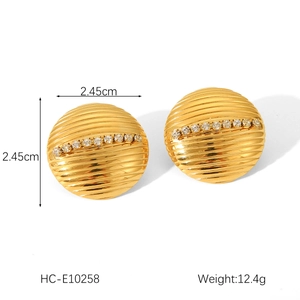 Detail view of 18K gold plated hoop earrings with ribbed texture and white zircon inlay