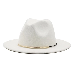 Detail of white wool fedora hat with black band and gold metallic tube accent