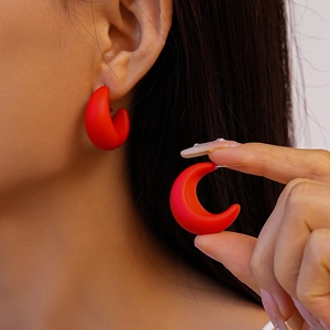 Minimalist red matte acrylic C-shaped earrings with a frosted geometric crescent design