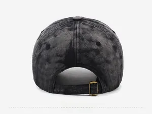 Detail view of the vintage washed baseball cap featuring an adjustable brass metal buckle