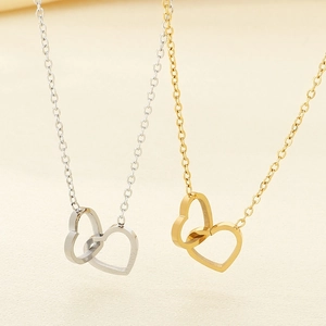 Minimalist double interlocking heart necklace in gold and silver stainless steel