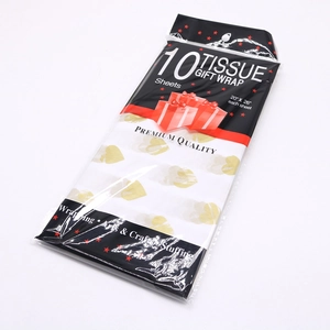 Ten sheets of white tissue gift wrap featuring gold heart patterns in retail packaging