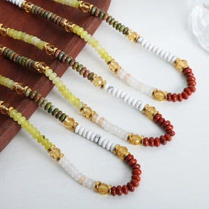 Close-up of Bohemian handmade beaded necklaces featuring colorful natural stone beads
