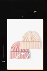 Close-up of thick ribbed knit texture on stylish two-tone pink and beige beanies