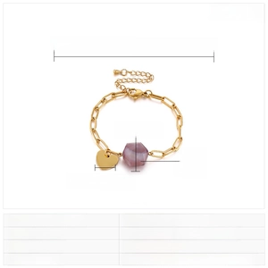 Macro detail of adjustable heart bracelet with purple glass bead and golden chain