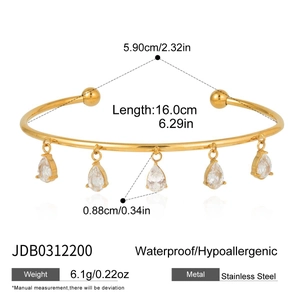 Detail of 18k gold plated stainless steel bangle with five zircon waterdrop charms