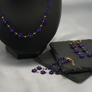 Bohemian blue flower bead jewelry set with necklace bracelet and earrings on a model