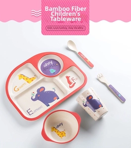 Close-up of a 5-piece bamboo fiber kids' dinnerware set with colorful animal illustrations