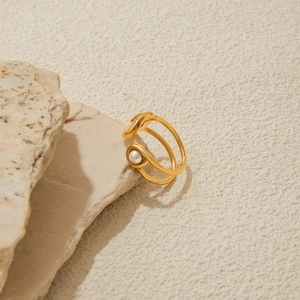 Detailed view of 18K gold plated stainless steel paperclip ring with a white pearl