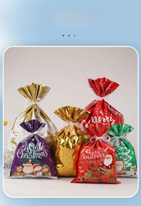 Detail of Christmas drawstring gift bags in assorted metallic colors and sizes