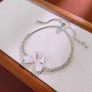 Detail of adjustable butterfly bracelet with gradient wings and pavé crystals