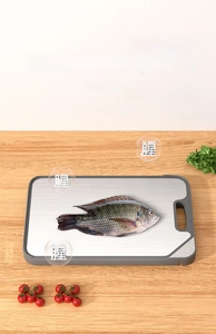 Kitchen cutting board with stainless steel surface for removing fishy smells and odors