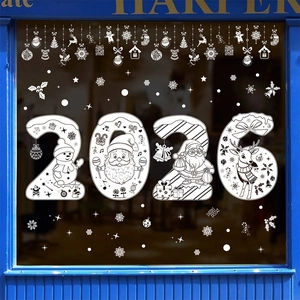 White 2026 Christmas reindeer window stickers with snowflakes on a glass storefront